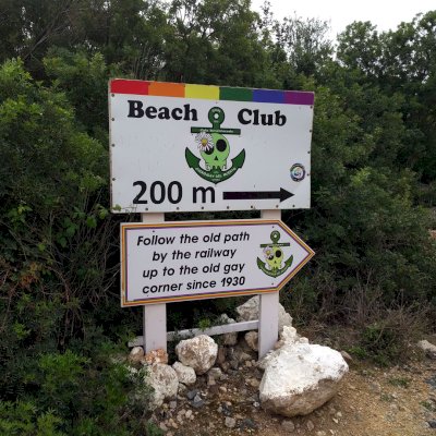 sign and direction to the gay beach